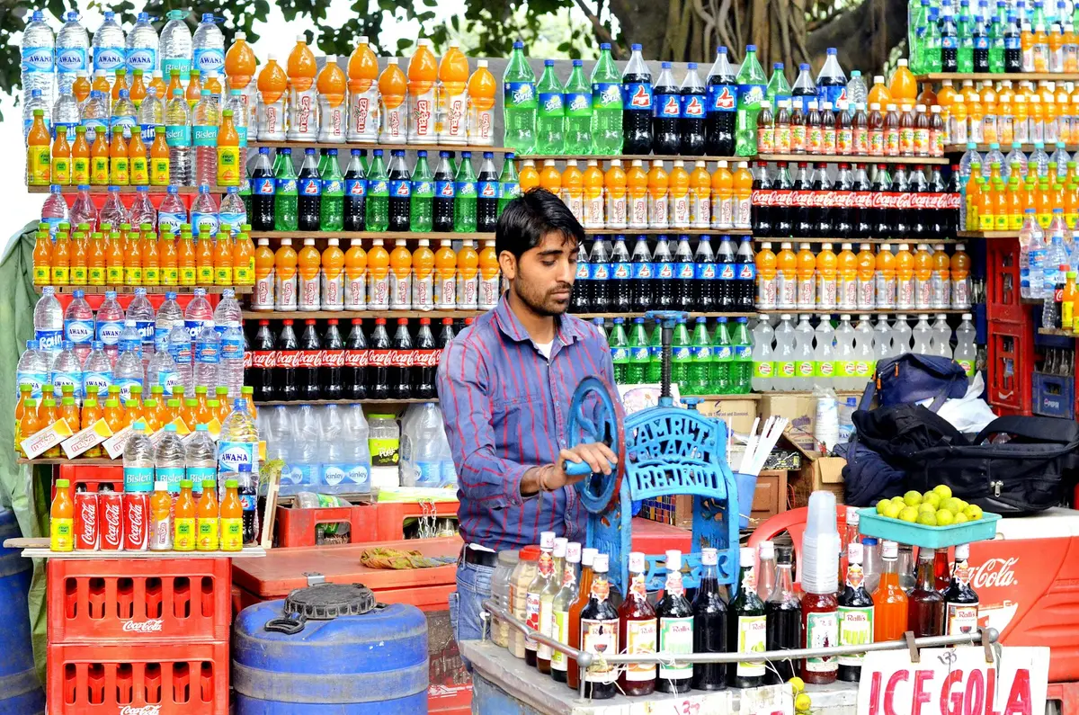 Shopkeeper standing inside a well-stocked general store